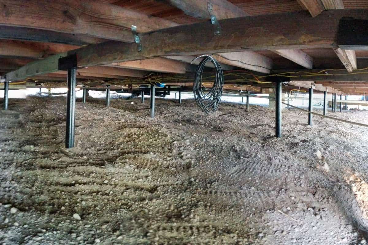 Quality Foundation Repair Austin Adjust-A-Piers installed across a Central Texas crawl space.