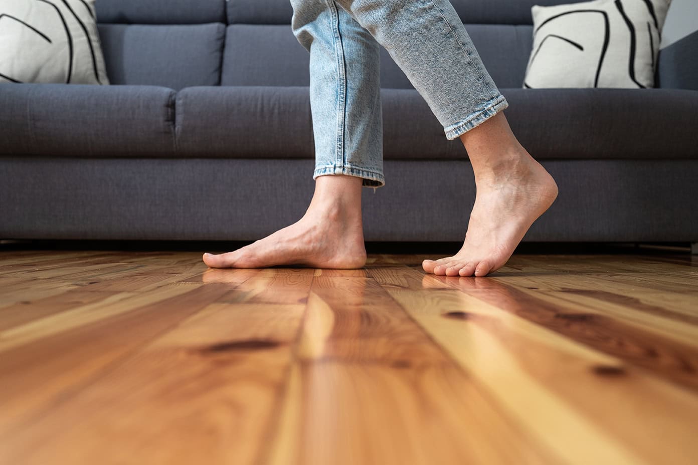 Quality Foundation Repair Austin showing signs of bouncing floors with bare feet on a wood floor.