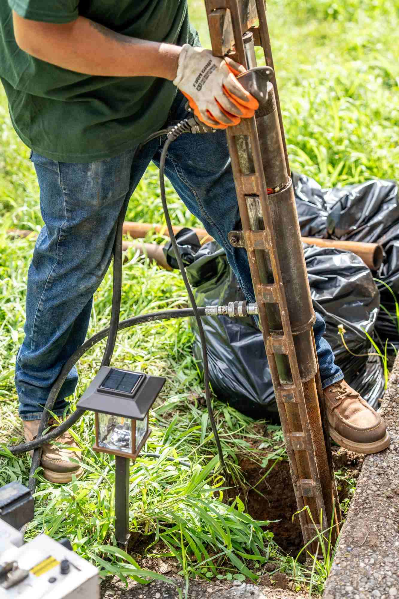 Quality Foundation Repair Austin technician installing crawl space foundation jacks.