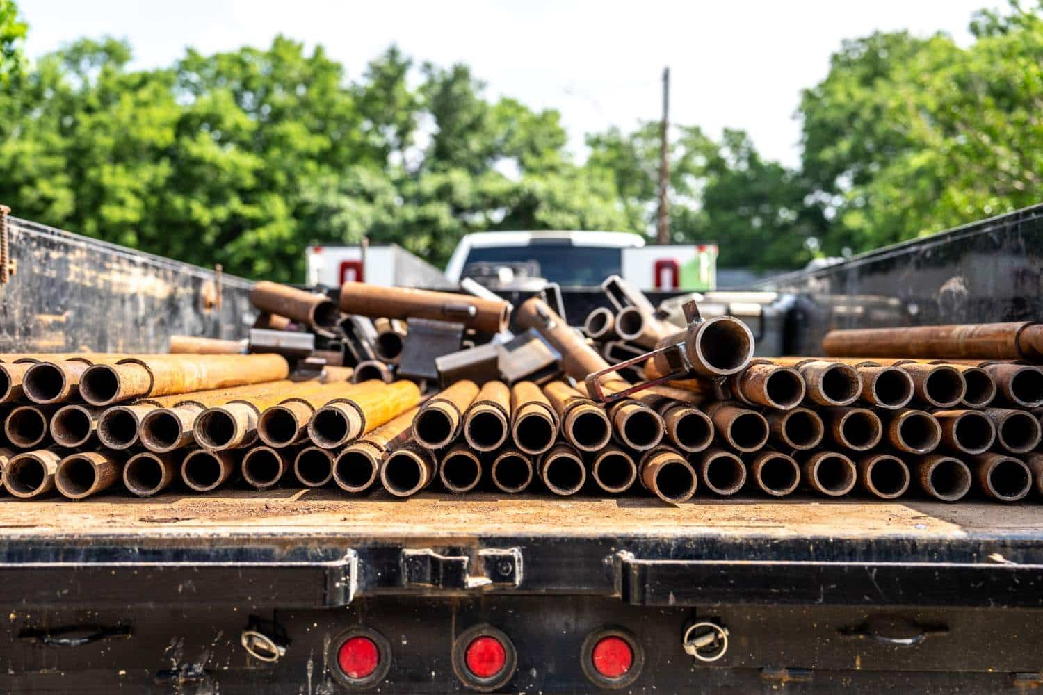 Quality Foundation Repair Austin steel pier sections loaded for delivery to a new construction site.