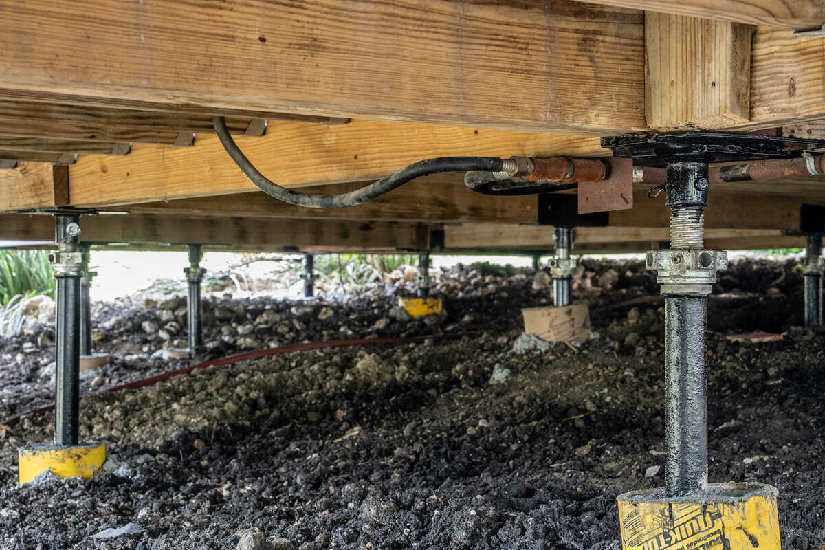 Quality Foundation Repair Austin new beam carried on adjustable piers with load pads.