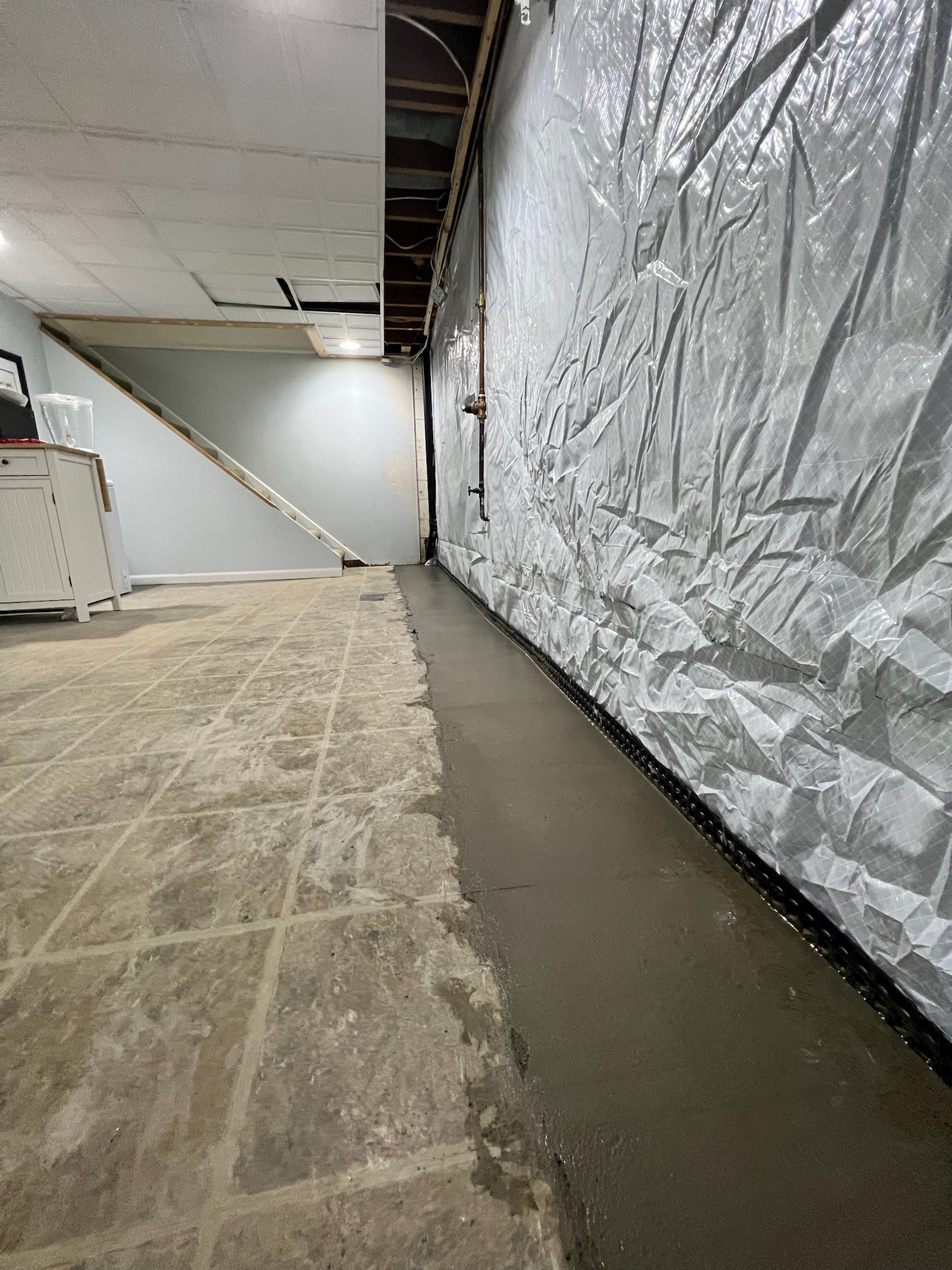 Foundation settlement repair completed to level an uneven floor in a Maryland home