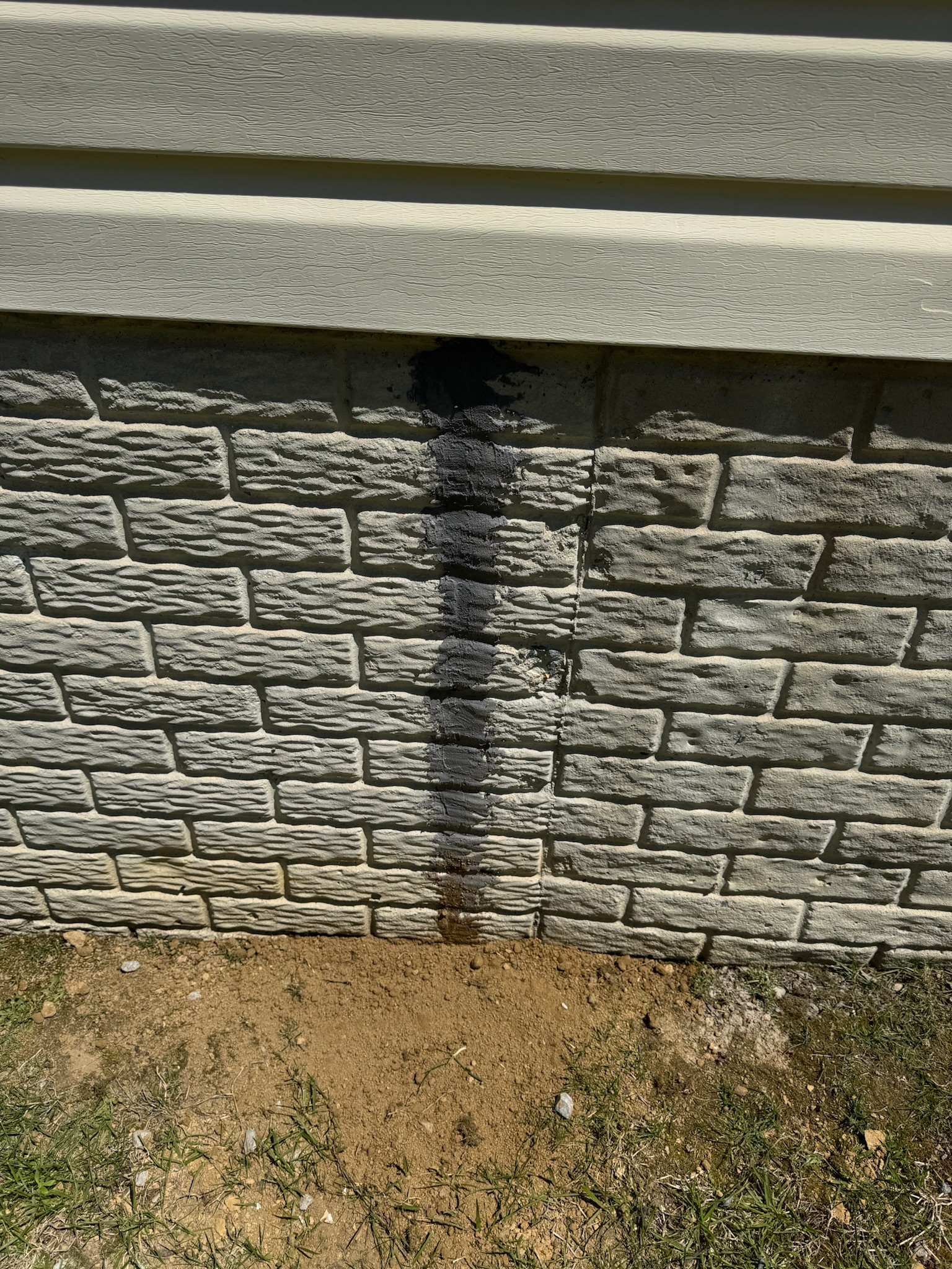 Exterior foundation crack sealed and parged