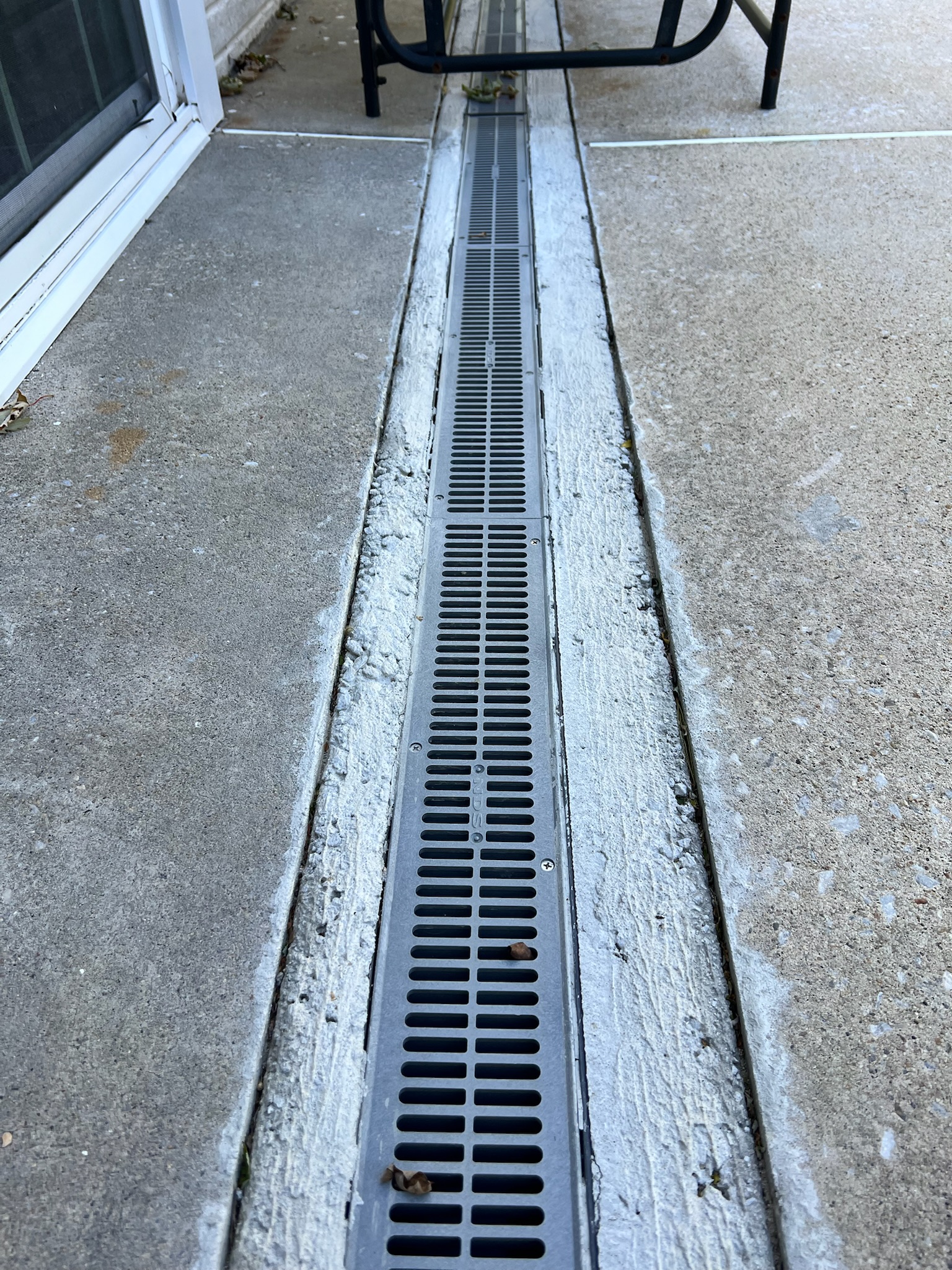 Oriole Basement Waterproofing installing a surface drain.