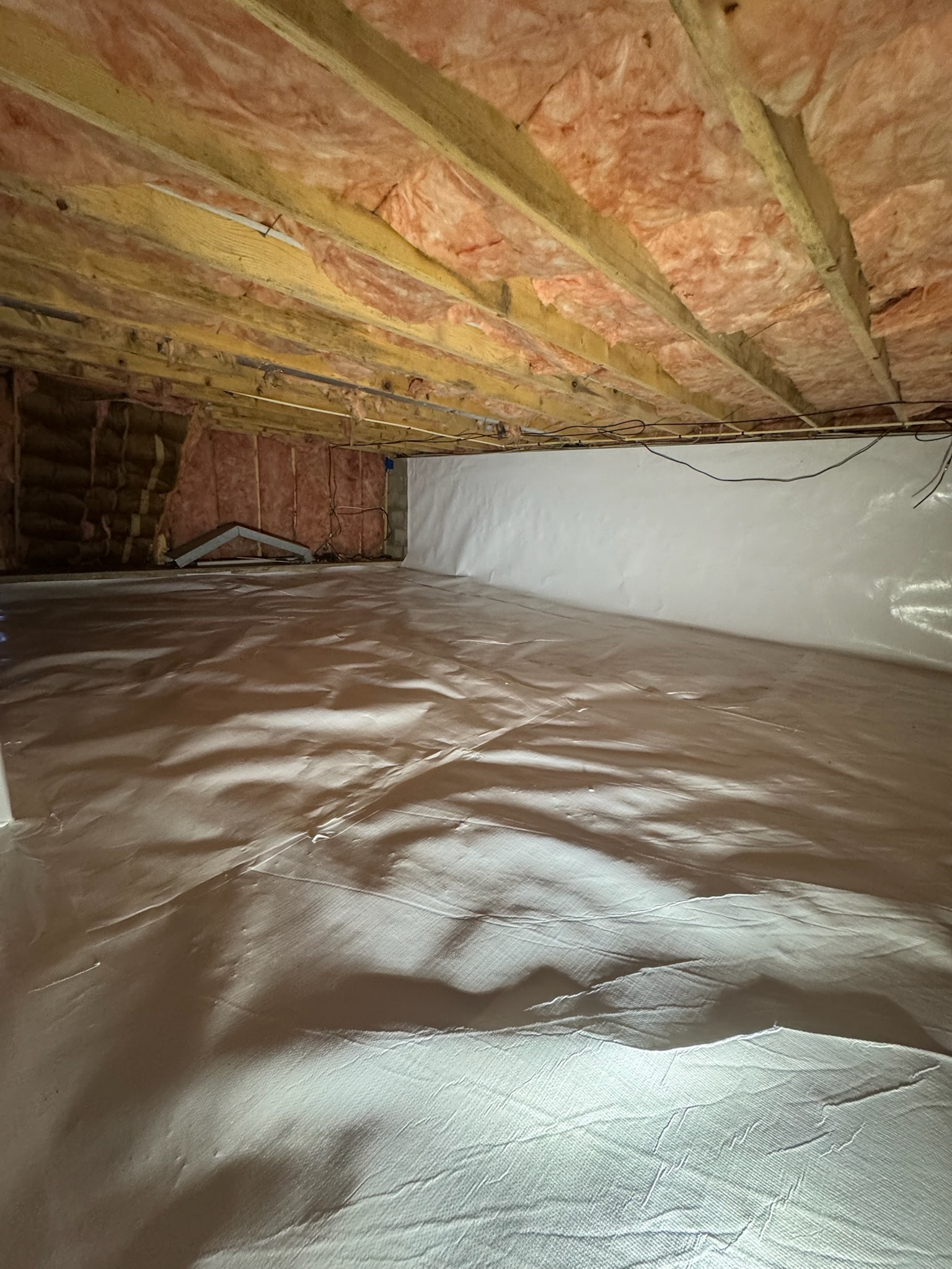 Vapor barrier and insulation installed in a Maryland crawl space