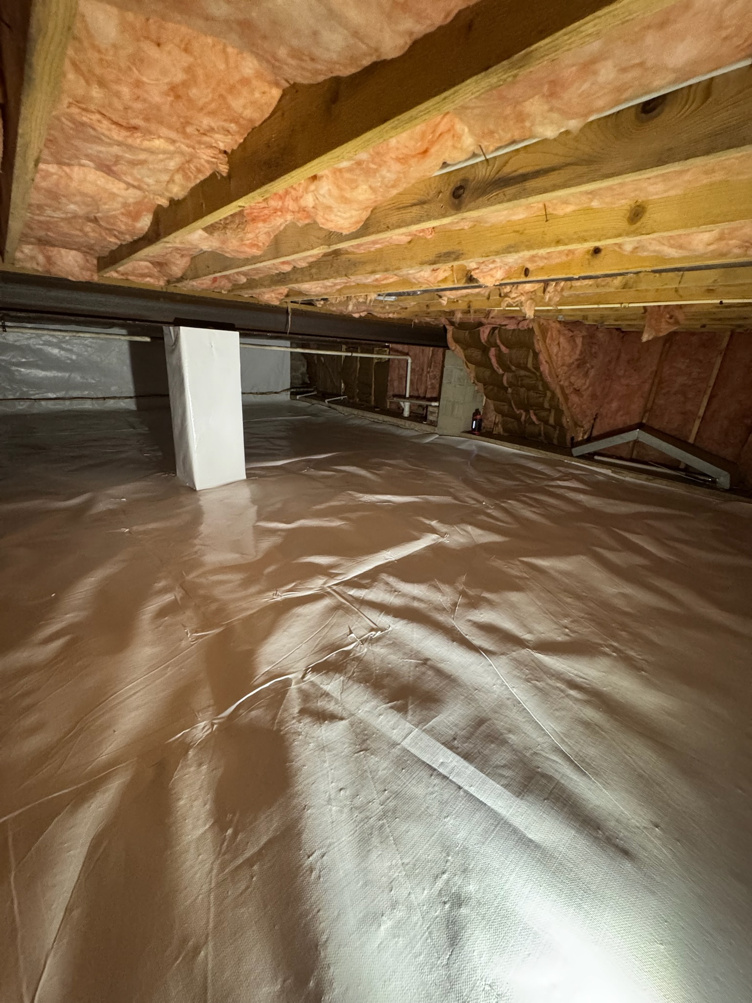 Oriole Basement Waterproofing installing vapor barrier and insulation in a crawl space.