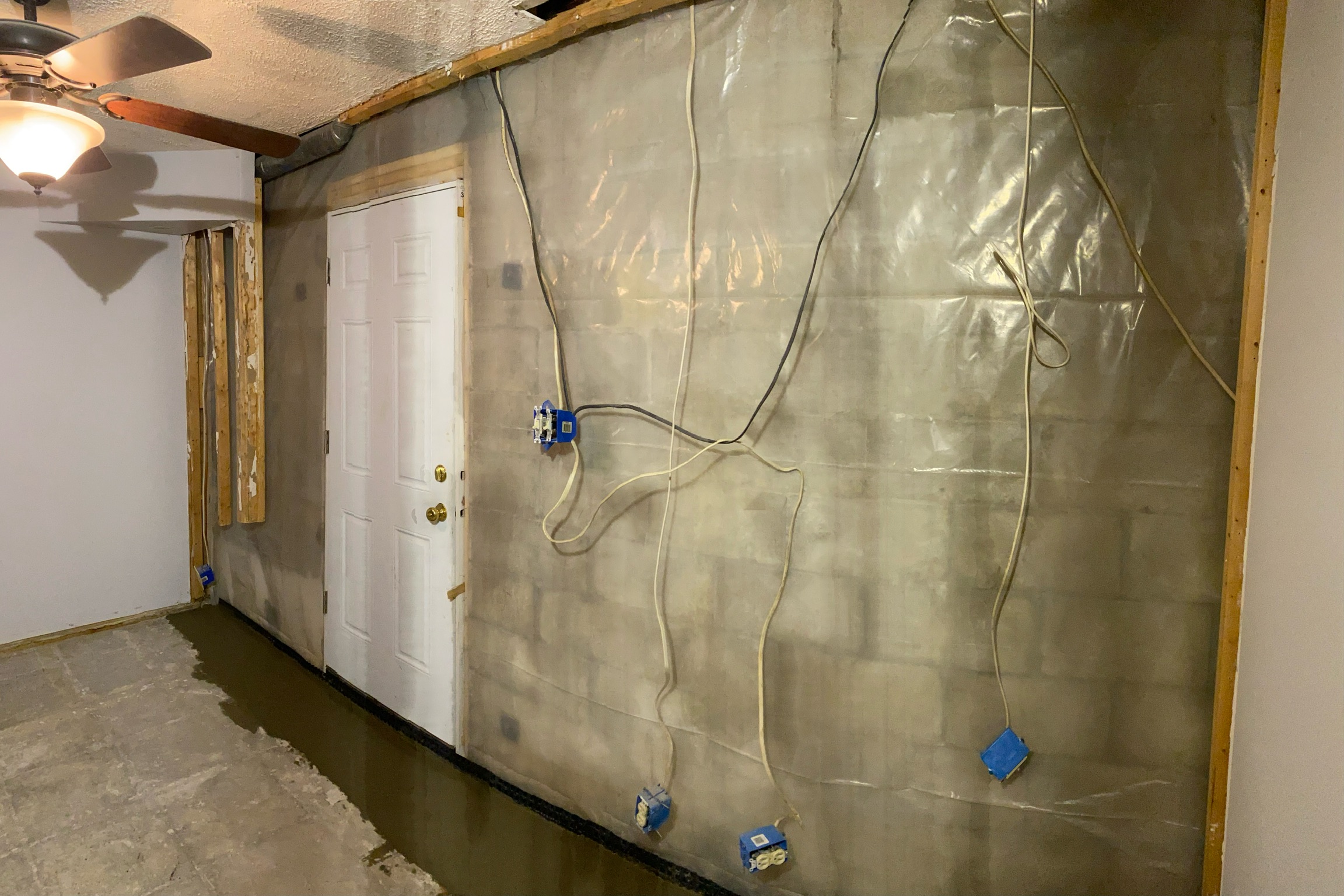 OBW crew installing vapor barrier and liner in a Maryland crawl space