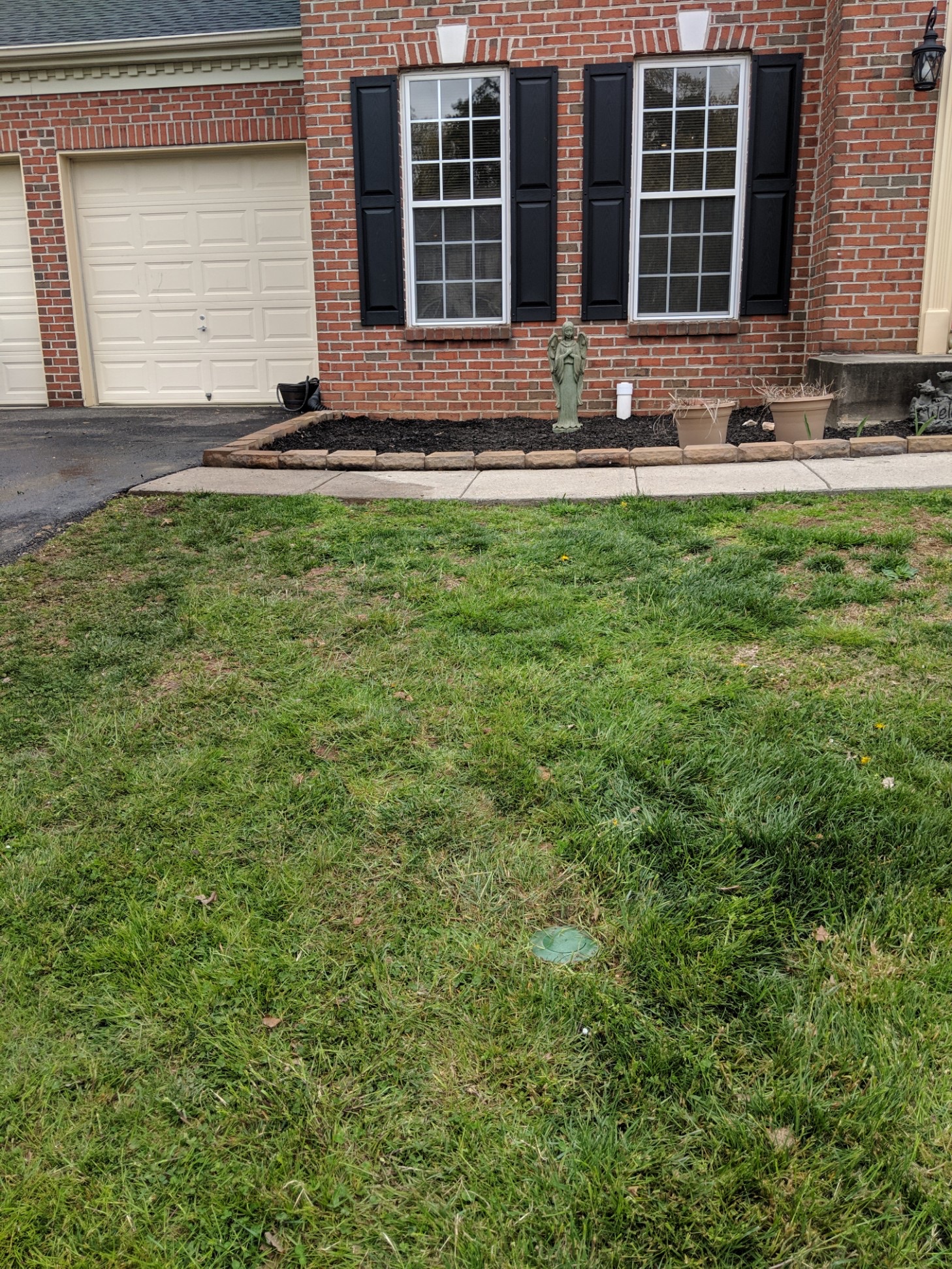 Exterior sump pump discharge pipe and ground drainage system in a Maryland yard
