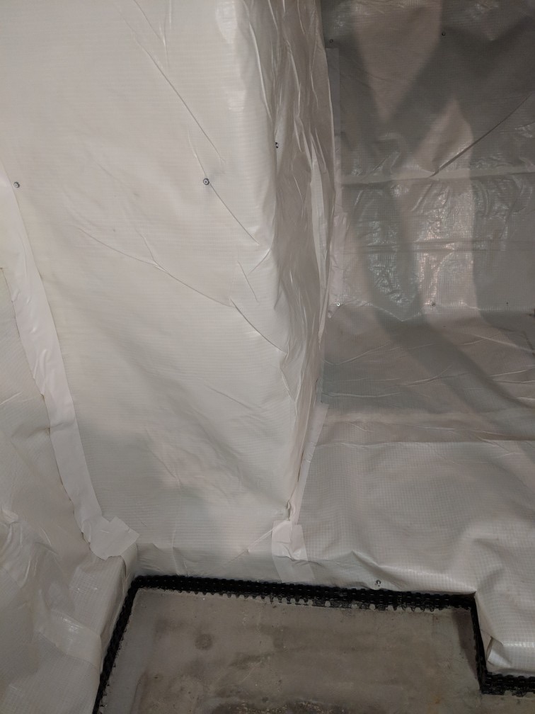 Encapsulated crawl space with a sealed liner and dry framing in a Maryland home