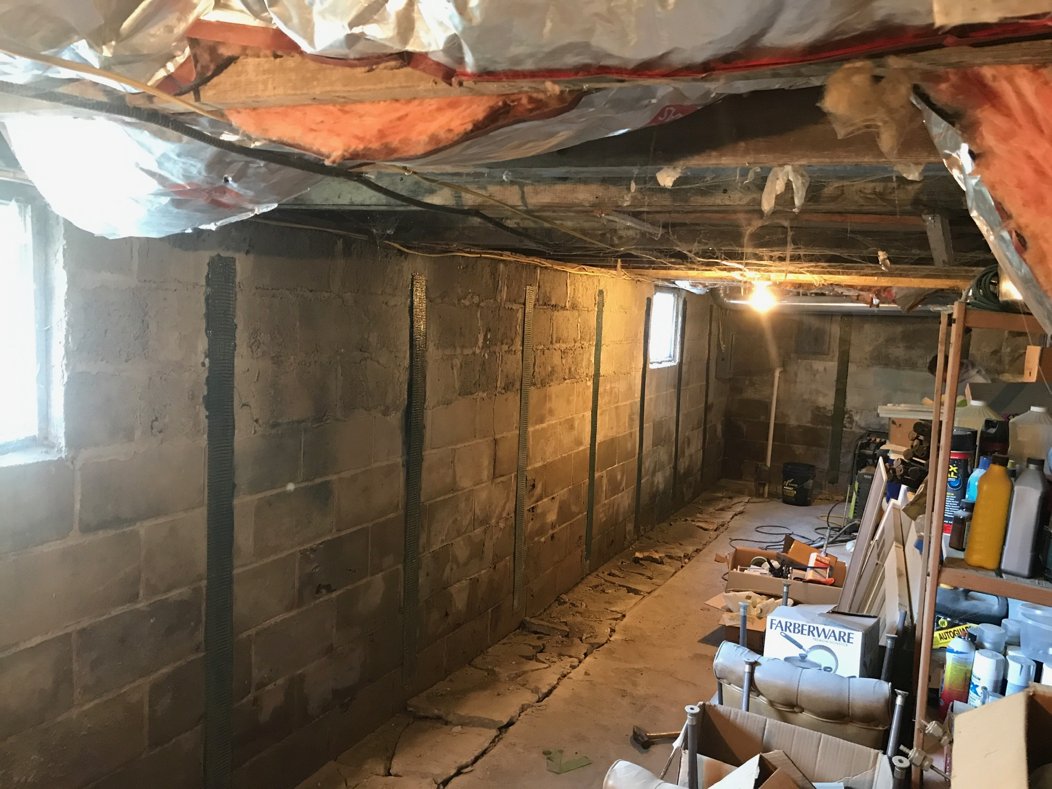 Carbon fiber reinforcement installed on a concrete block wall in a Maryland home near affected cabinetry