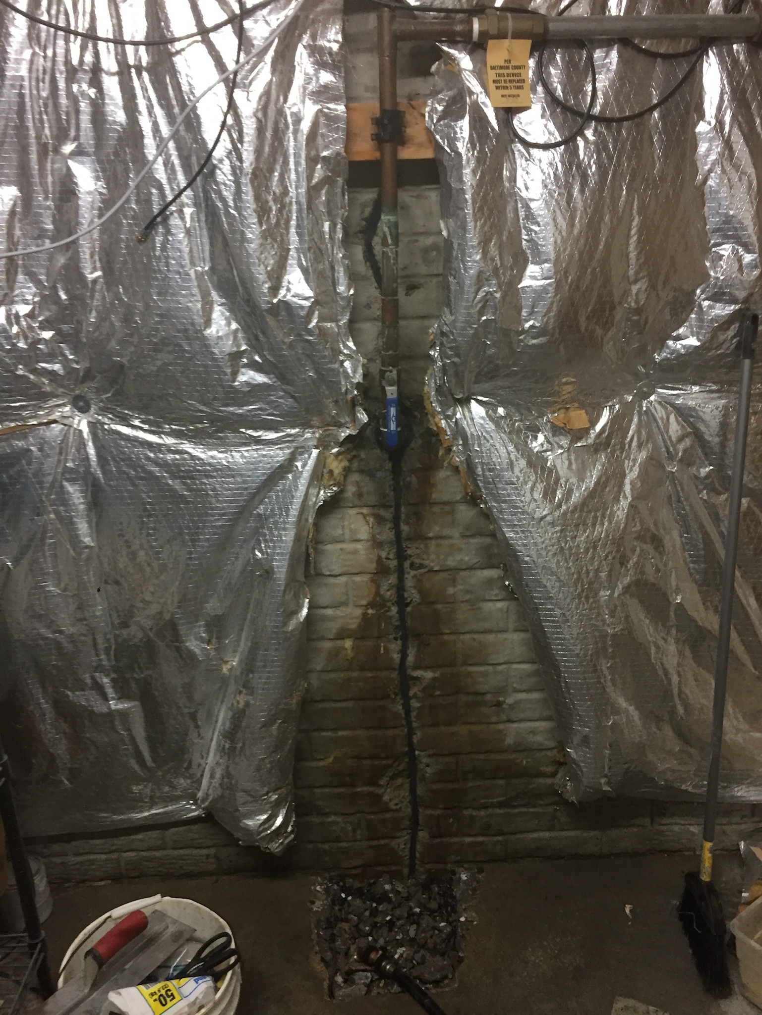 Cracked brick foundation repair completed in a Maryland home