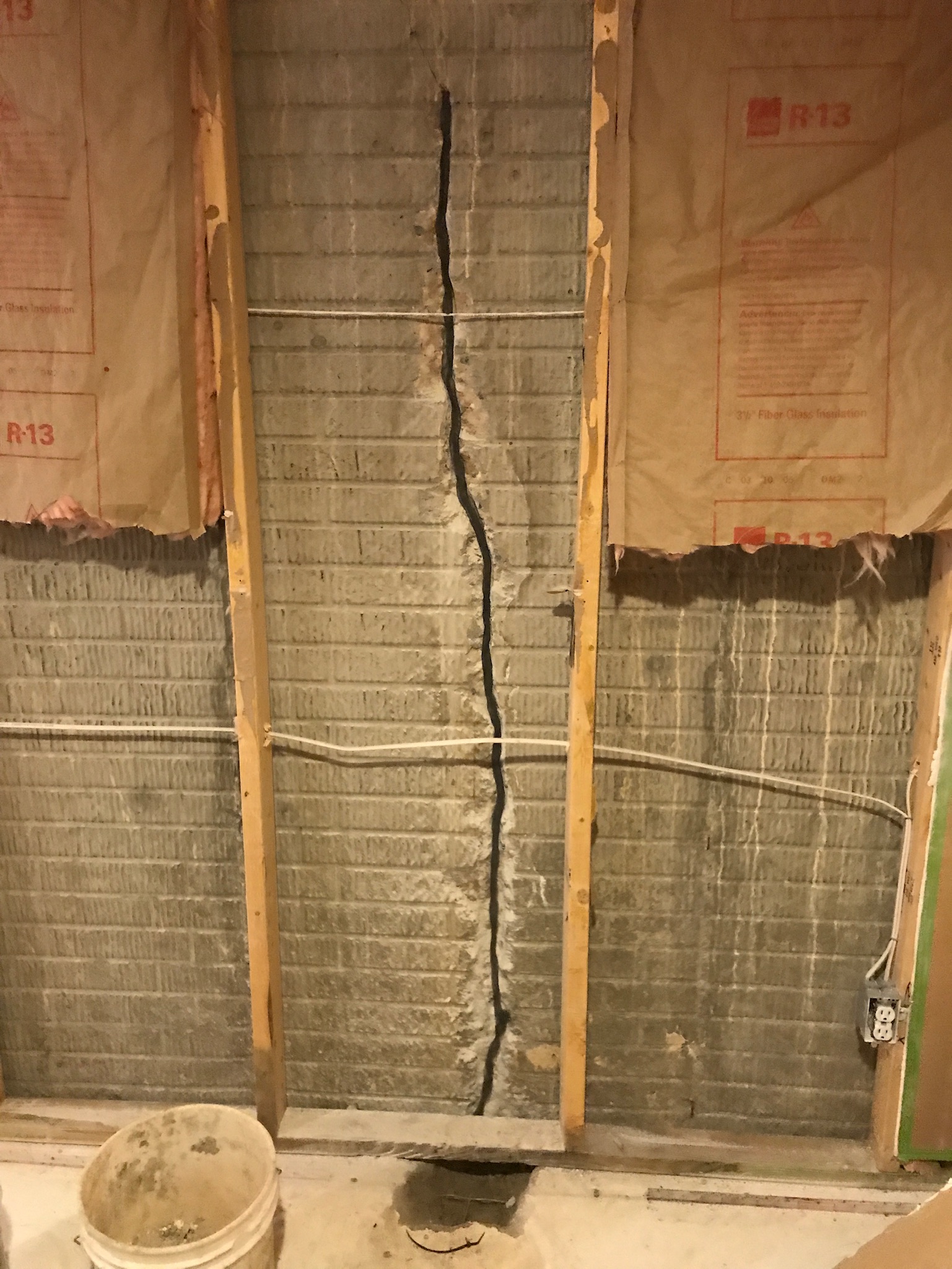 Crack exposed behind wall framing before the method is specified