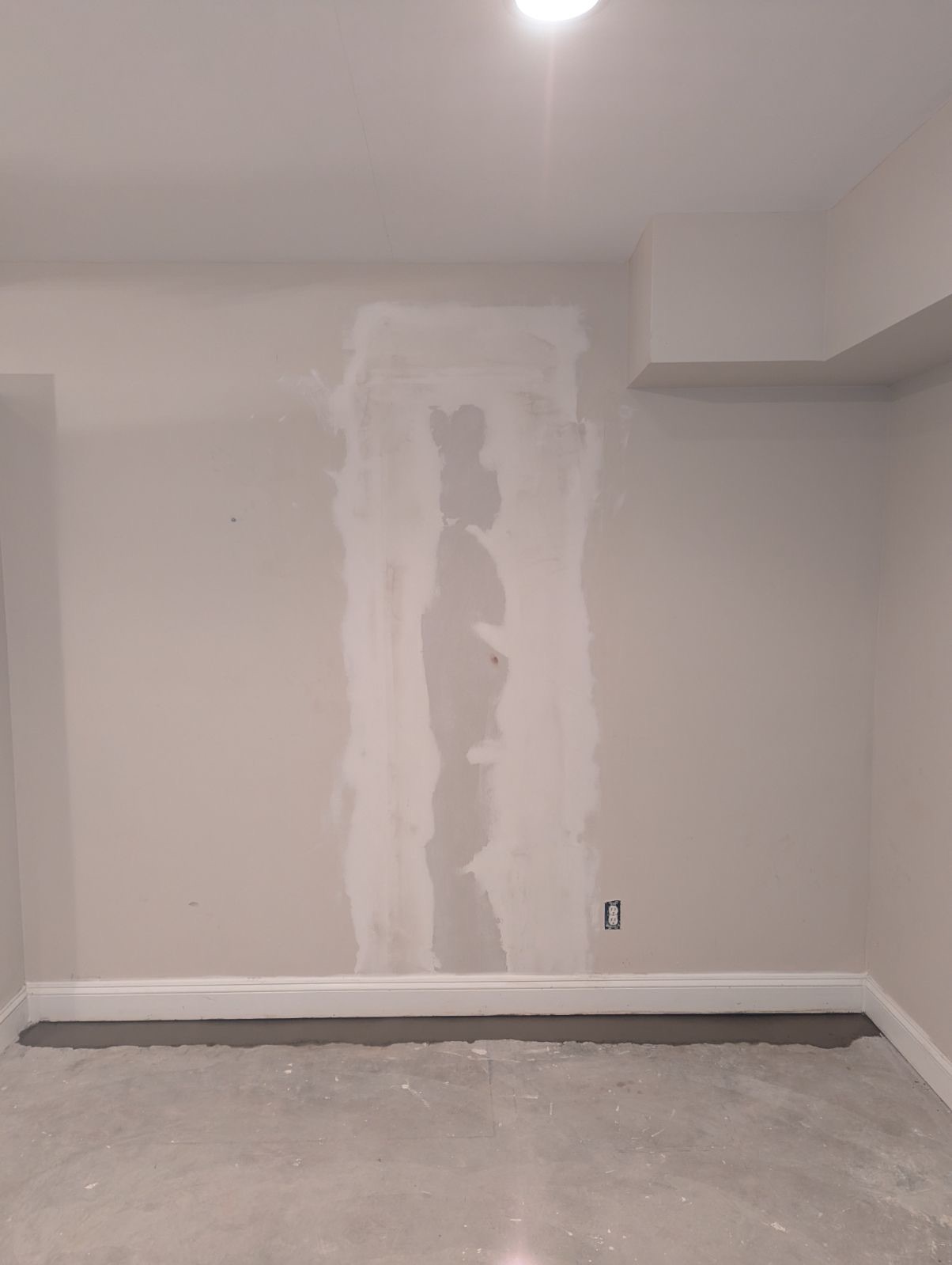 Interior basement wall crack after patching