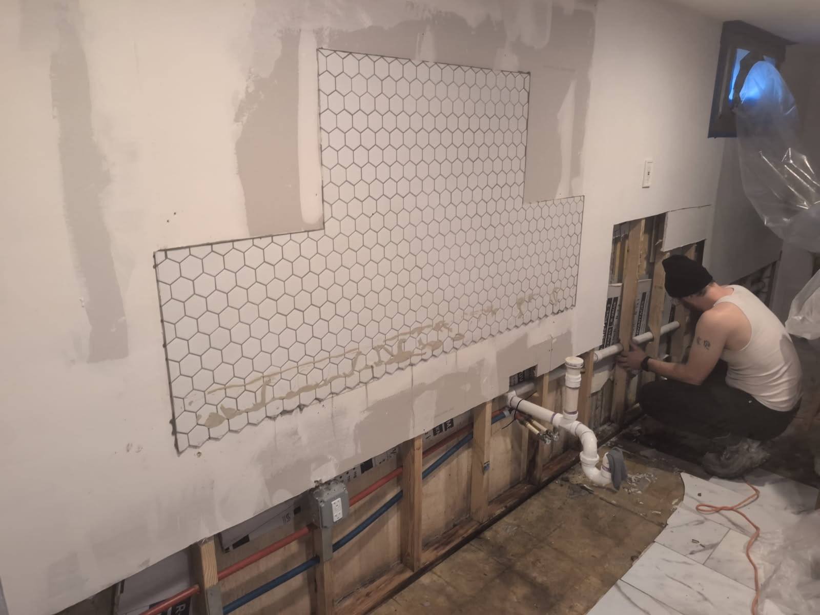 Wet drywall with mold growth exposed in a finished Maryland basement