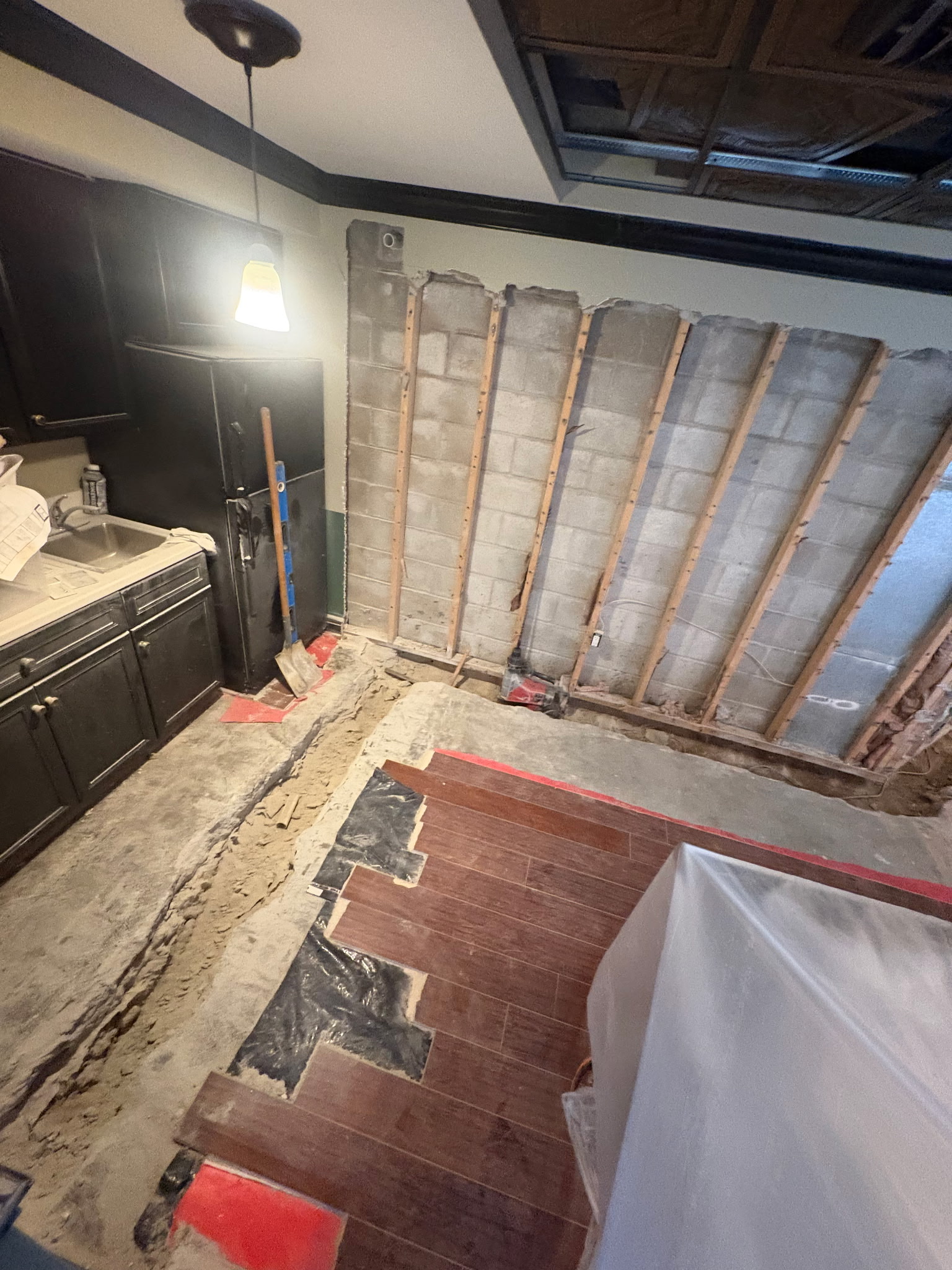 Interior drainage trench at footer of Maryland block foundation wall