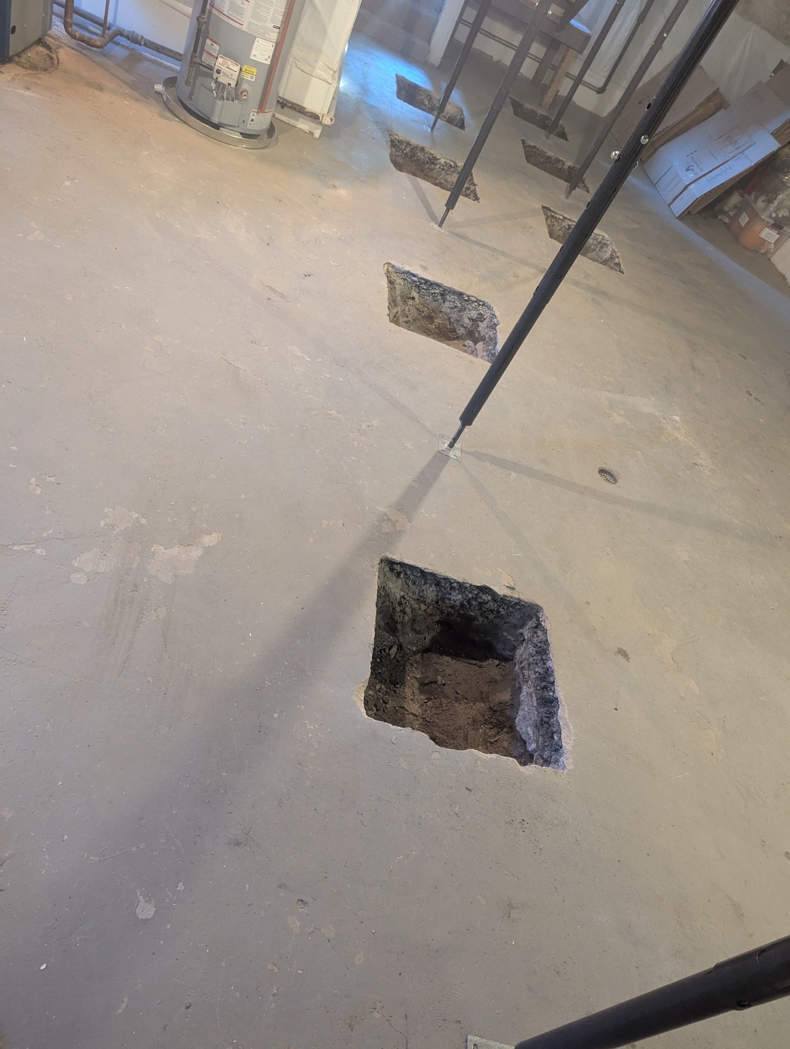 Slab opened to expose the footing and soil below