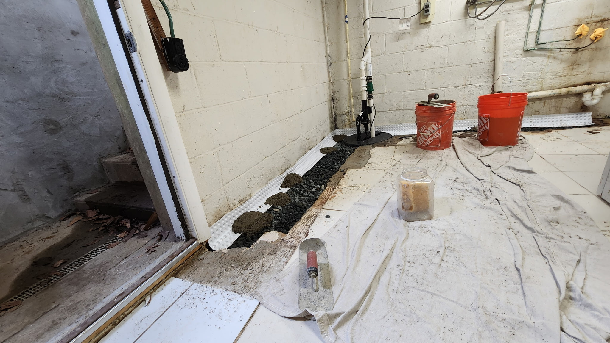 Crawl space drainage repair completed to stop standing water in a Maryland home