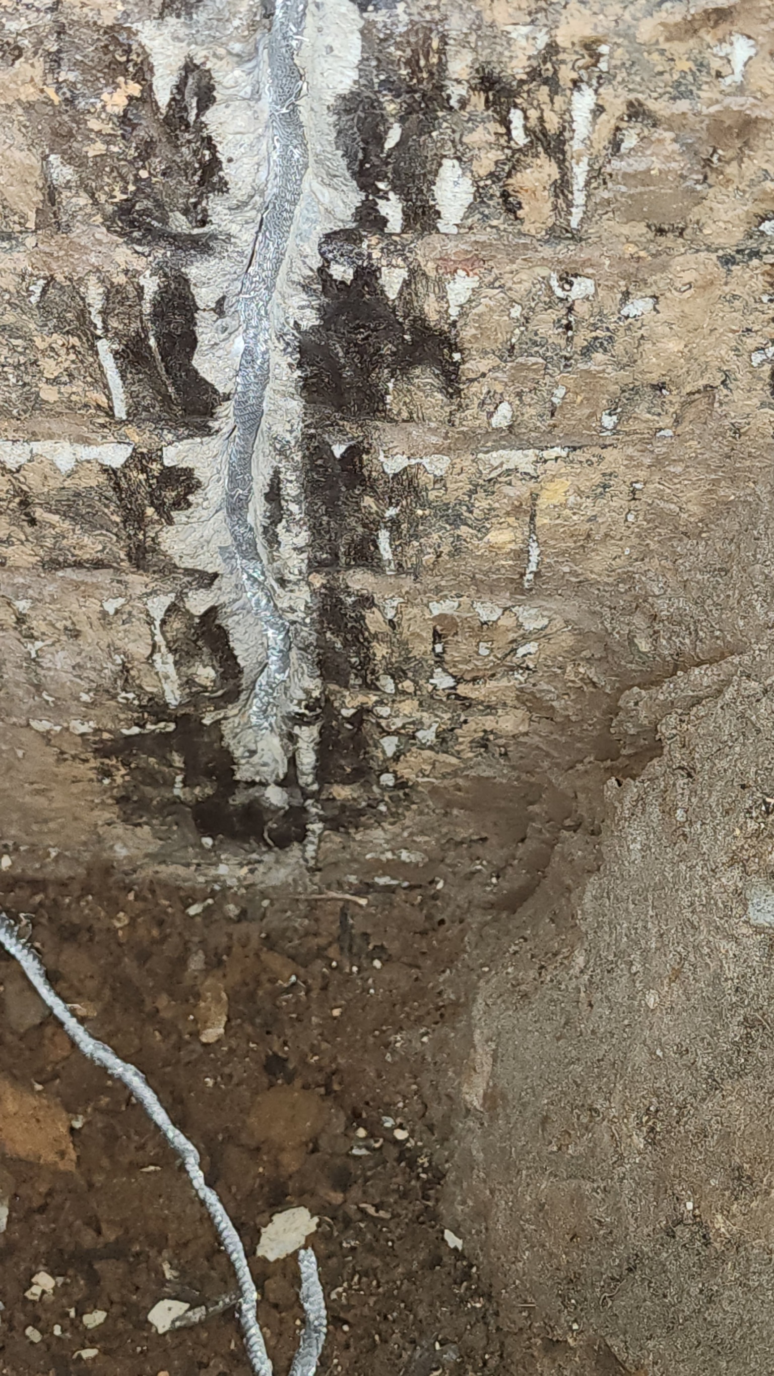 Epoxy applied to vertical crack in basement block foundation wall