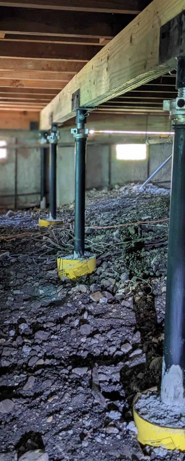 Quality Foundation Repair Austin Adjust-A-Piers supporting sagging floors in a crawl space.