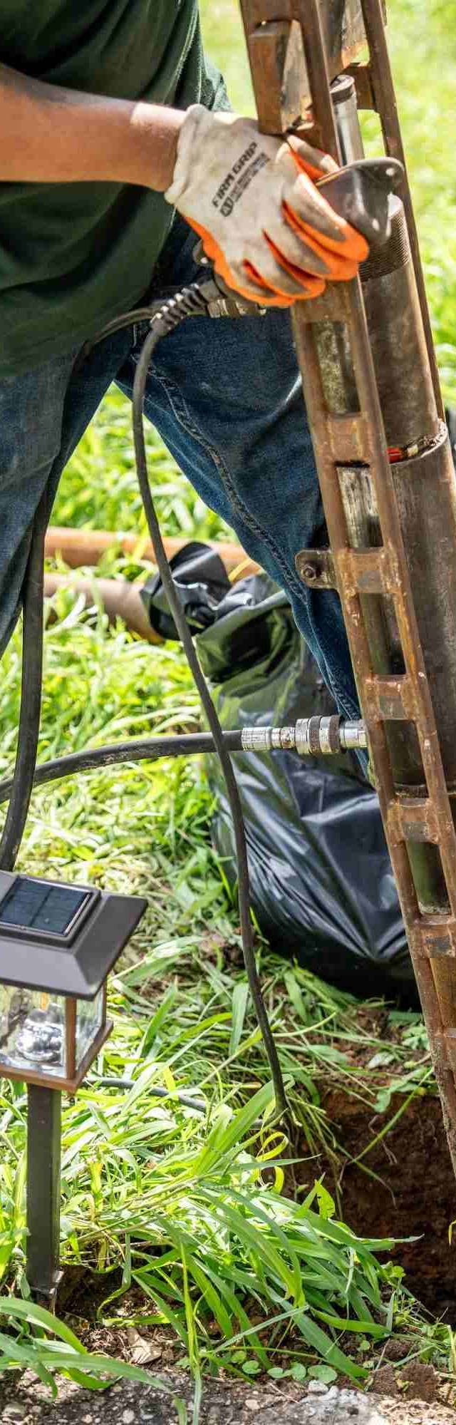 Quality Foundation Repair Austin technician installing crawl space foundation jacks.
