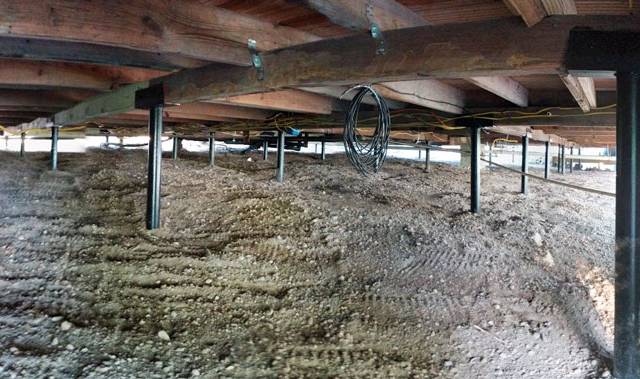 Quality Foundation Repair Austin Adjust-A-Piers and steel piers set across a crawl space.
