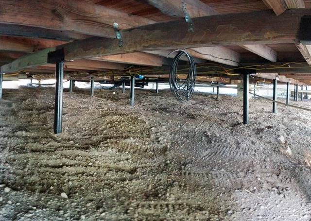 Quality Foundation Repair Austin Adjust-A-Piers supporting sagging floor joists in a crawl space.